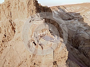 Aerial view  of the ruins of Massada is a fortress built by Herod the Great on a cliff-top off the coast of the Dead Sea.