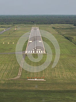 Aerial view runway at dusk.