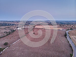 Aerial view of a rural field in Sicily at early sunrise