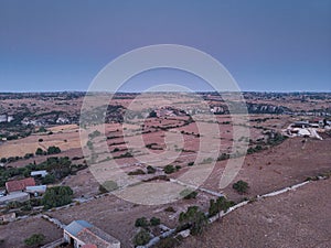 Aerial view of a rural field in Sicily at early sunrise