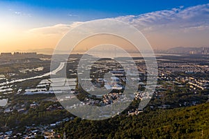 Aerial View of rural green fields in Hong Kong border and skylines in Shenzhen