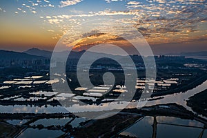 Aerial View of rural green fields in Hong Kong border and skylines in Shenzhen