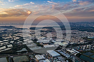 Aerial View of rural green fields in Hong Kong border and skylines in Shenzhen