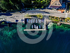 Aerial view of rural road by the sea with fishing boats in Italy