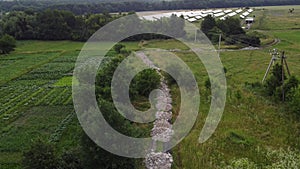 Aerial view of rural roads. View of rice fields along the road. The road passing cultivated area, countryside.