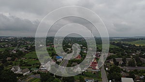 Aerial view of rural roads. View of rice fields along the road. The road passing cultivated area, countryside.