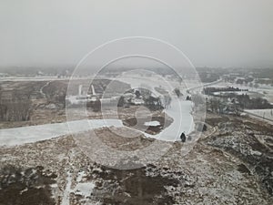 Aerial view of a rural scene landscape with winter weather and snow