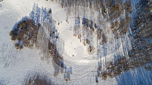 Aerial view of russian winter landscape with long shadows Top view