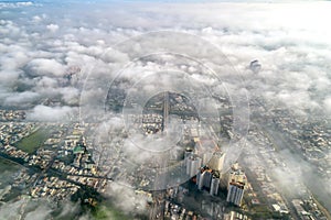 Aerial view of Saigon cityscape at morning with misty sky in Southern Vietnam