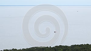Aerial view of sail boat in the lagoon on a calm cloudy day. Fishing boat in the sea