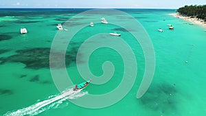 Aerial view of sailing boats, tropical beach and caribbean sea. Holiday on exotic island. Dominican Republic