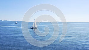 Aerial view of sailing luxury yacht at opened sea at sunny day in Croatia