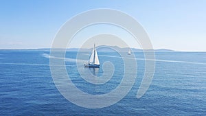 Aerial view of sailing luxury yacht at opened sea at sunny day in Croatia