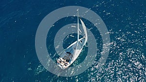 Aerial view. Sailing yachts with white sails in the open Sea.