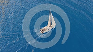Aerial view. Sailing yachts with white sails in the open Sea.