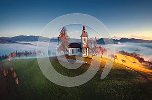 Aerial view of Saint Tomas church, Slovenia photo