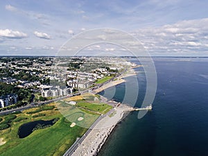 Aerial view on Salthill, Galway city, Ireland, Tilt shift effect, Blackrock diving board, Warm sunny day. People swimming in the