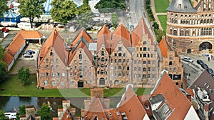 Aerial view of Salzspeicher warehouses in old town, beautiful architecture, sunny day, Lubeck, Germany
