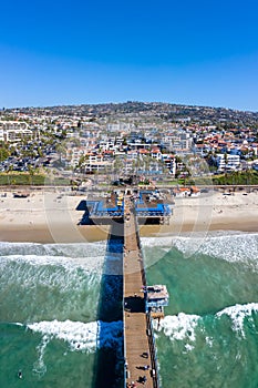 Aerial view of San Clemente California with pier and beach sea vacation portrait format in the United States