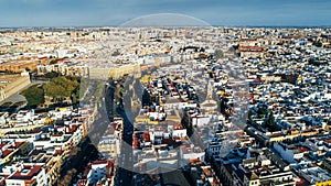 Aerial view of San Gil neighborhood in Seville,Andalusia,Spain. Main traffic street near Andalusian Parliament,catholic church photo