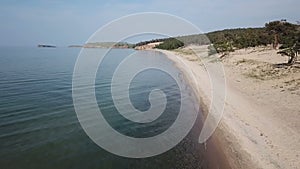 Aerial view of sand beach and crystal clean water of Baikal Lake.