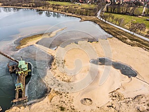 Aerial view of a sand mining area and the associated excavation lake