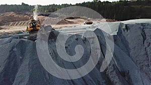 Aerial view of sand mining site conveyor with professional equipment at work. Stock footage. Flying above stone quarry