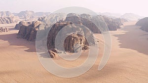 Aerial view of the sand plains and mountain ranges of Wadi Rum, Jordan.