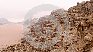 Aerial view of the sand plains and mountain ranges of Wadi Rum, Jordan.