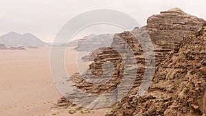 Aerial view of the sand plains and mountain ranges of Wadi Rum, Jordan.