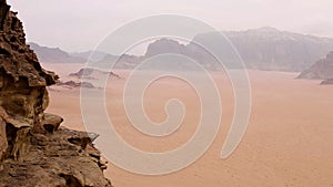 Aerial view of the sand plains and mountain ranges of Wadi Rum, Jordan.