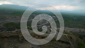 Aerial view of sand quarry, industrial extraction of sand in Bali.