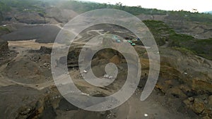 Aerial view of sand quarry, industrial extraction of sand in Bali.