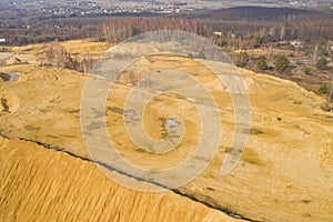 Aerial view of sandpit and factory plant producing sand materials for construction industry. Top view of industrial place. Photo