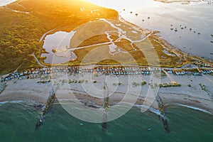 Aerial view of a sandy beach at sunset in Hengistbury