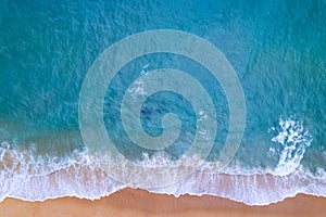 Aerial view sandy beach and waves Beautiful tropical sea in the morning summer season image by Aerial view drone shot, high angle