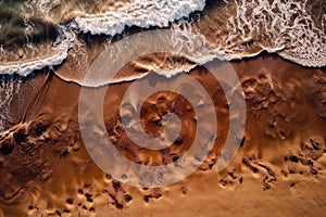 an aerial view of a sandy beach with waves coming in and out of the water and sand on the beach and the ocean floor below