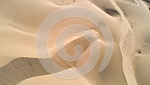 Aerial View of Sandy Desert Dunes Texture Landscape Pattern in Warm Colors
