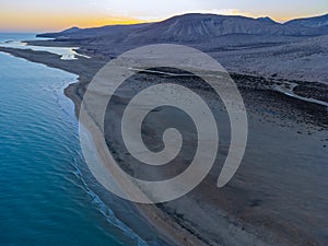 Aerial view on sandy dunes and turquoise water of Sotavento beach, Costa Calma, Fuerteventura, Canary islands, Spain in winter