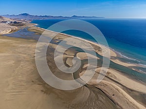 Aerial view on sandy dunes and turquoise water of Sotavento beach, Costa Calma, Fuerteventura, Canary islands, Spain in winter