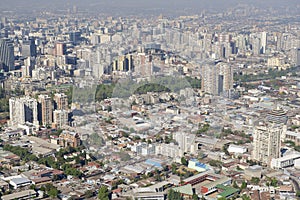 Aerial view of the Santiago city with the blue smog from the San Cristobal Hill, Santiago, Chile