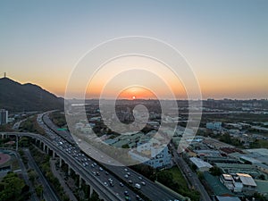 Aerial view of Sanxia District with cars on highway during sunset in New Taipei City, Taiwan