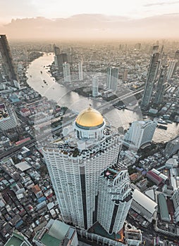 Aerial view of Saphan Taksin district near the Taksin bridge and Chao Phraya river, Bangkok, Thailand