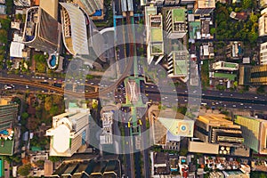 Aerial view of Sathorn intersection or junction with cars traffic, Bangkok Downtown, Thailand. Financial district and business
