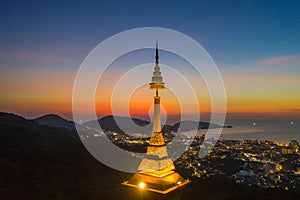 aerial view scenery sunset above pagoda of Doi Thepnimit temple on the highest of Patong mountain..