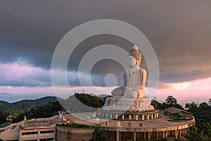 .aerial view scenery sunset with rain clouds moving above beautiful Phuket big Buddha.