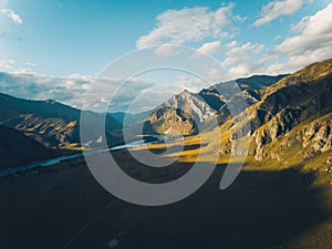Aerial view of scenic autumn mountain landscape with river. Drone shot