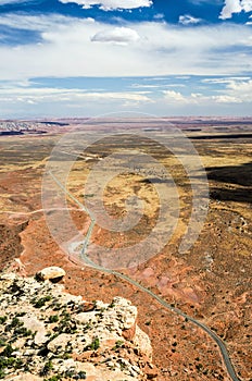 Aerial view of scenic desert landscape with small dirt road