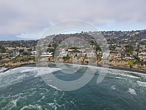 Aerial view of the the sea with cliff in La Jolla Hermosa town during gray day