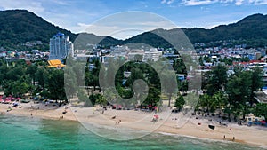 Aerial view of sea front hotels and apartments and tourists enjoying the beach in Patong beach, Phuket island, Thailand.